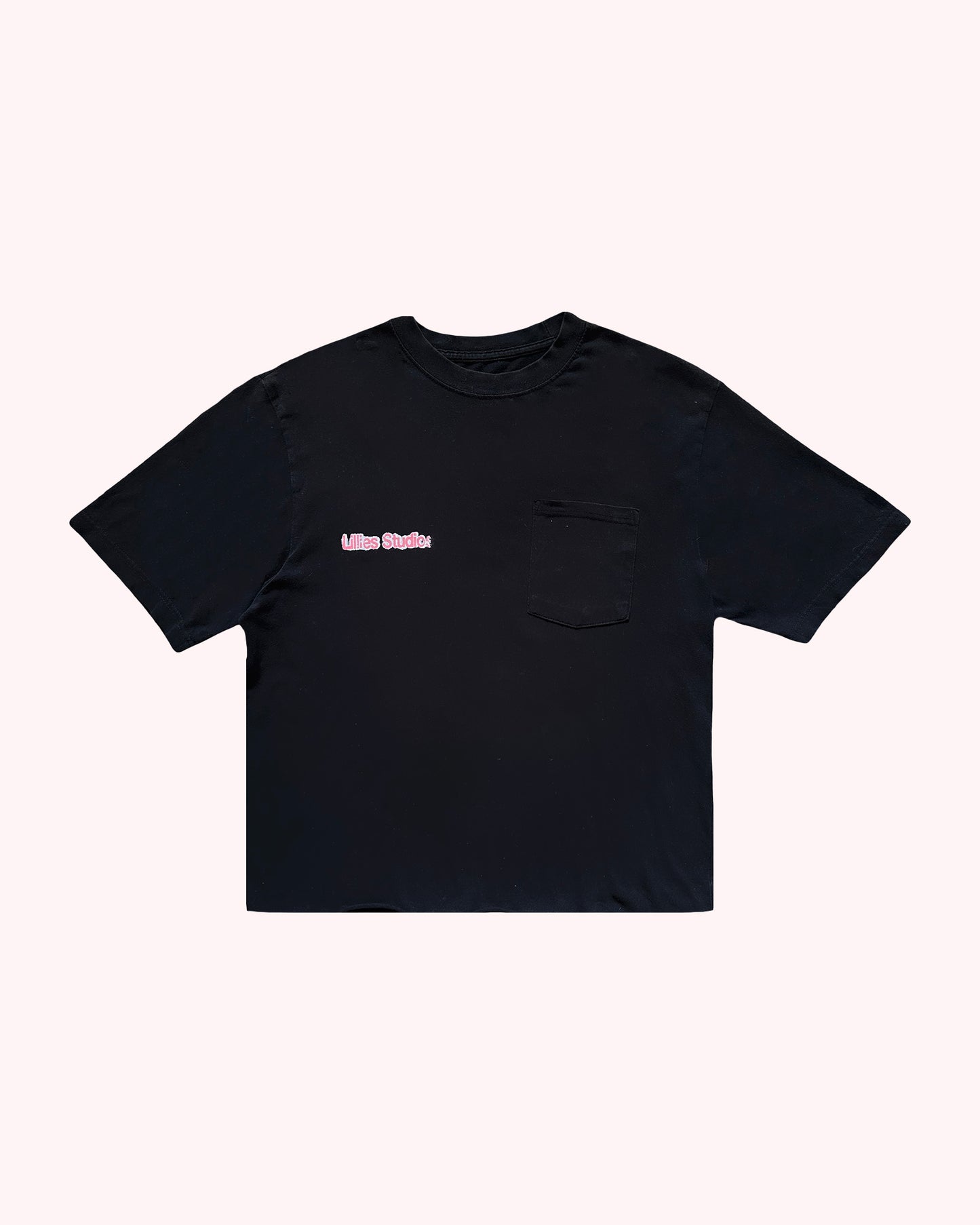 Black t-shirt with a small pink logo on a white background
