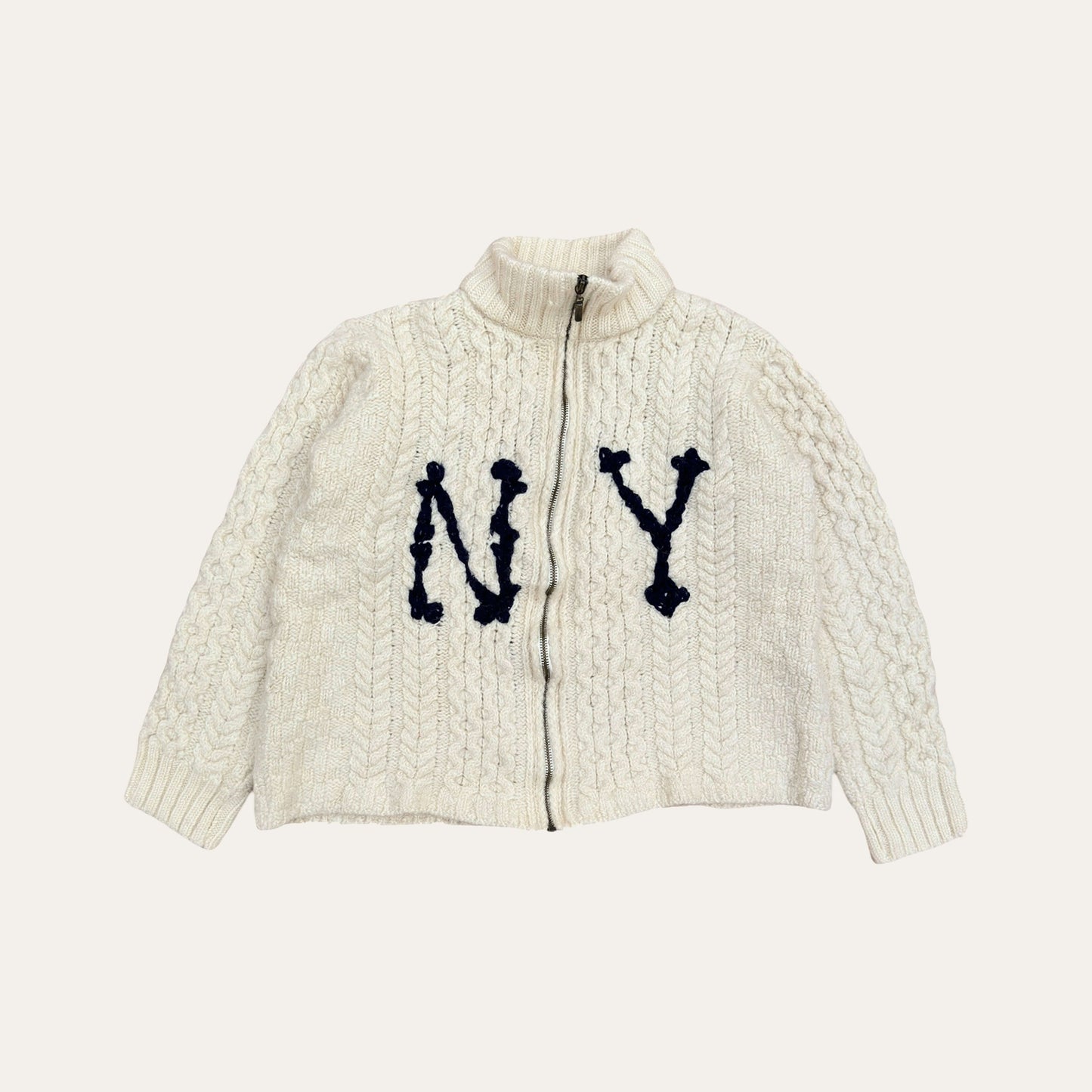 Hand-embroidered fisherman sweater Cardigan with vintage inspired typography, crafted from genuine second-hand Irish Aran Sweaters.