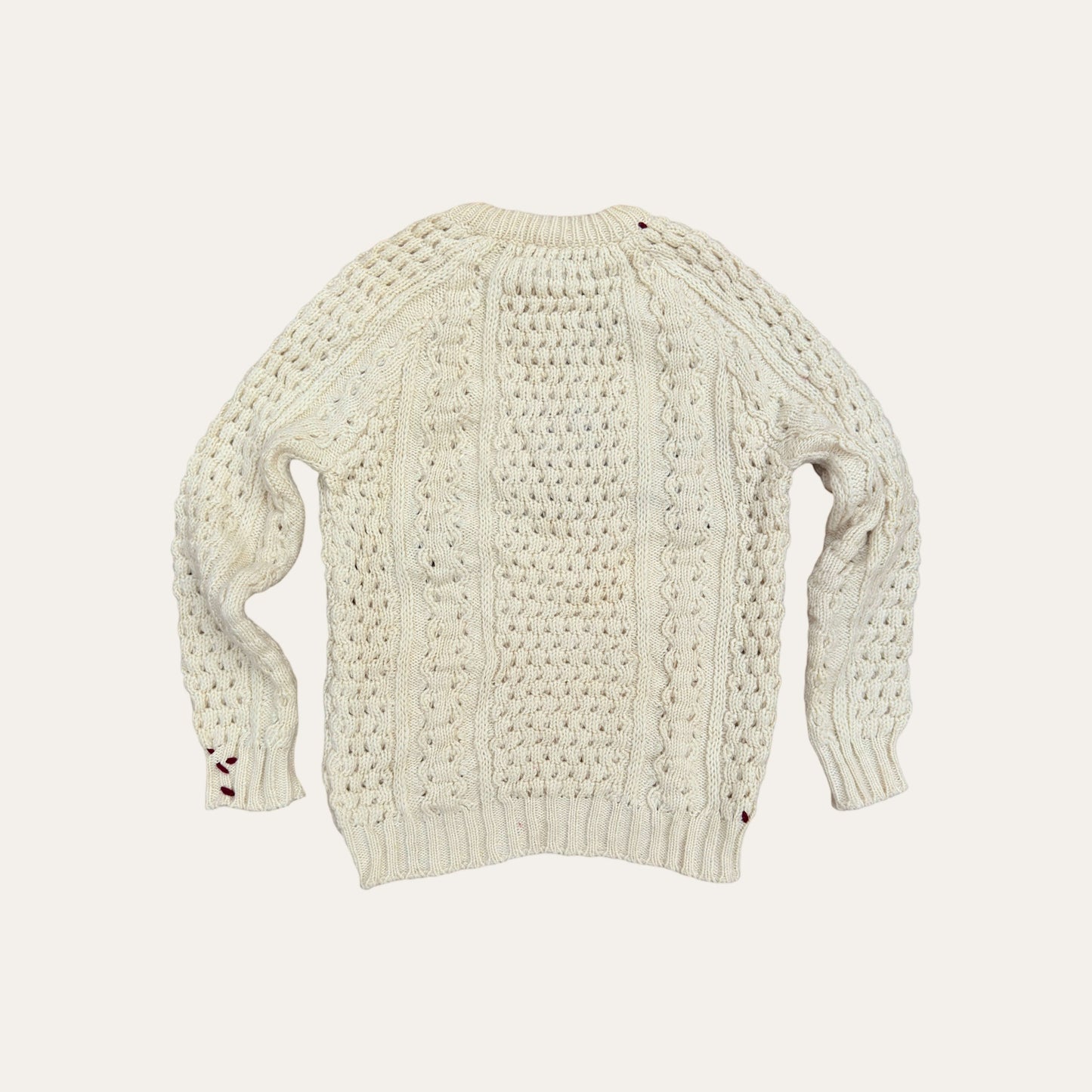 Hand-embroidered fisherman sweater with vintage inspired typography, crafted from genuine second-hand Irish Aran Sweaters.