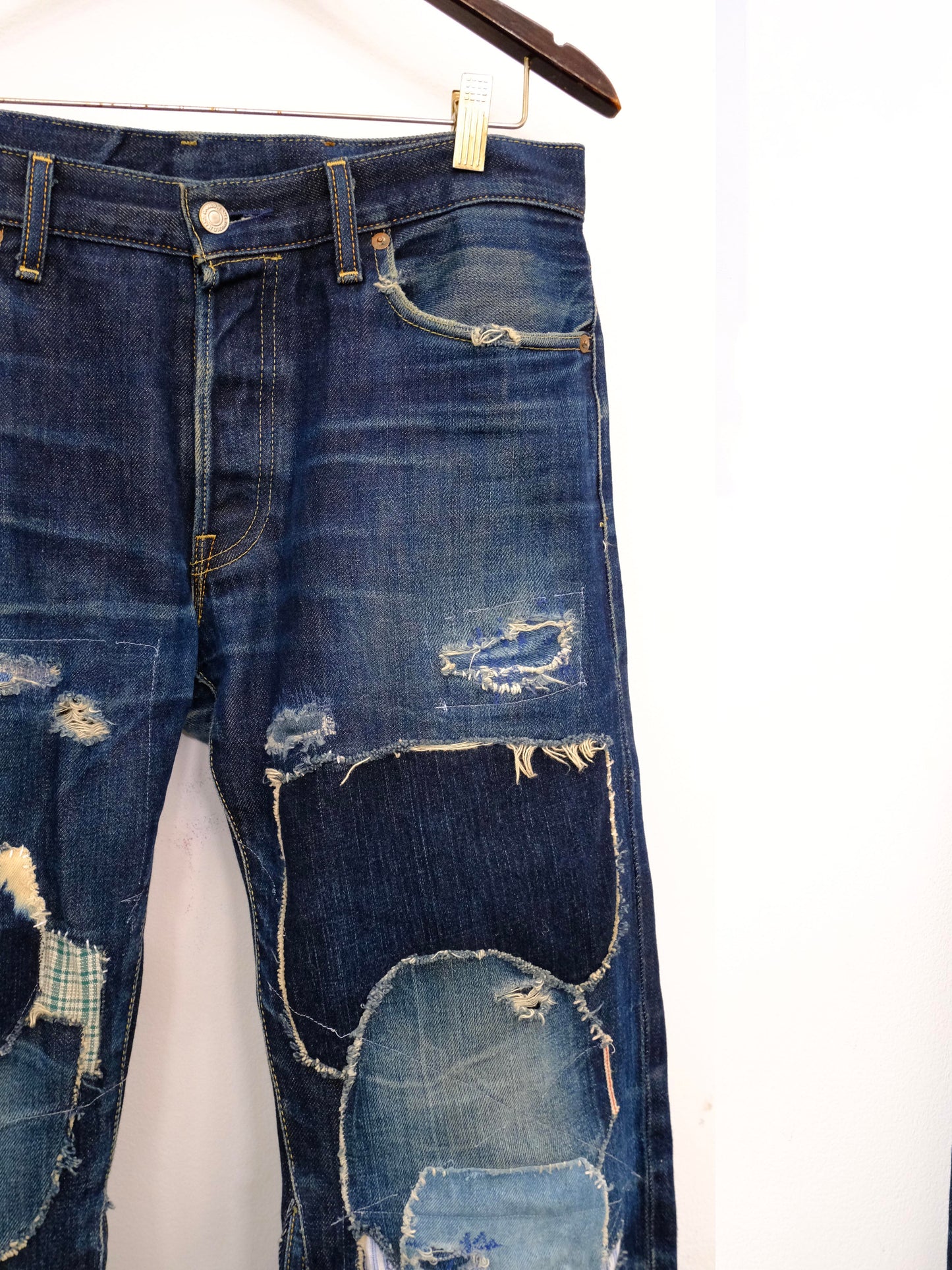 (front top detail): Japanese Selvedge Patchwork Denim – front waistband and knee detail, dark indigo selvedge denim with frayed patchwork repairs – Lillies Studios
