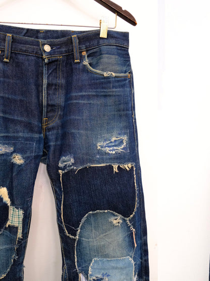 (front top detail): Japanese Selvedge Patchwork Denim – front waistband and knee detail, dark indigo selvedge denim with frayed patchwork repairs – Lillies Studios
