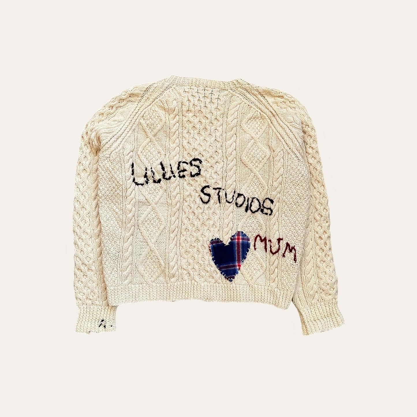 Hand-embroidered fisherman sweater Cardigan with vintage inspired typography, crafted from genuine second-hand Irish Aran Sweaters.