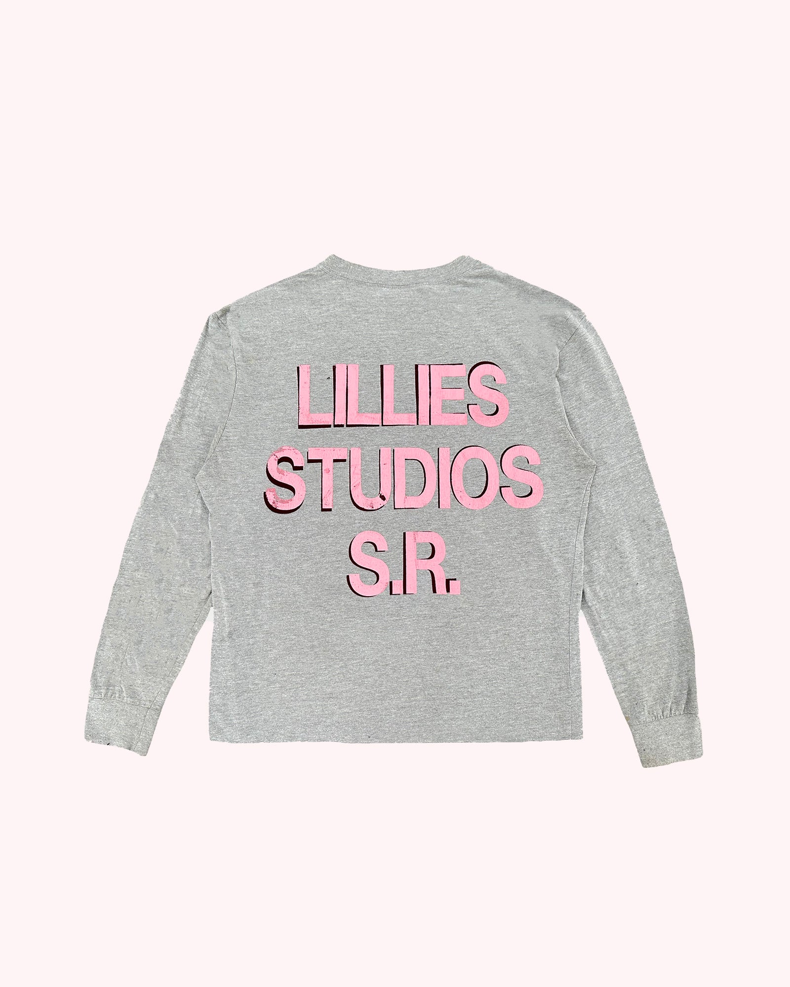 Gray long-sleeve shirt with pink text 'LILLIES STUDIOS S.R.' on a white background