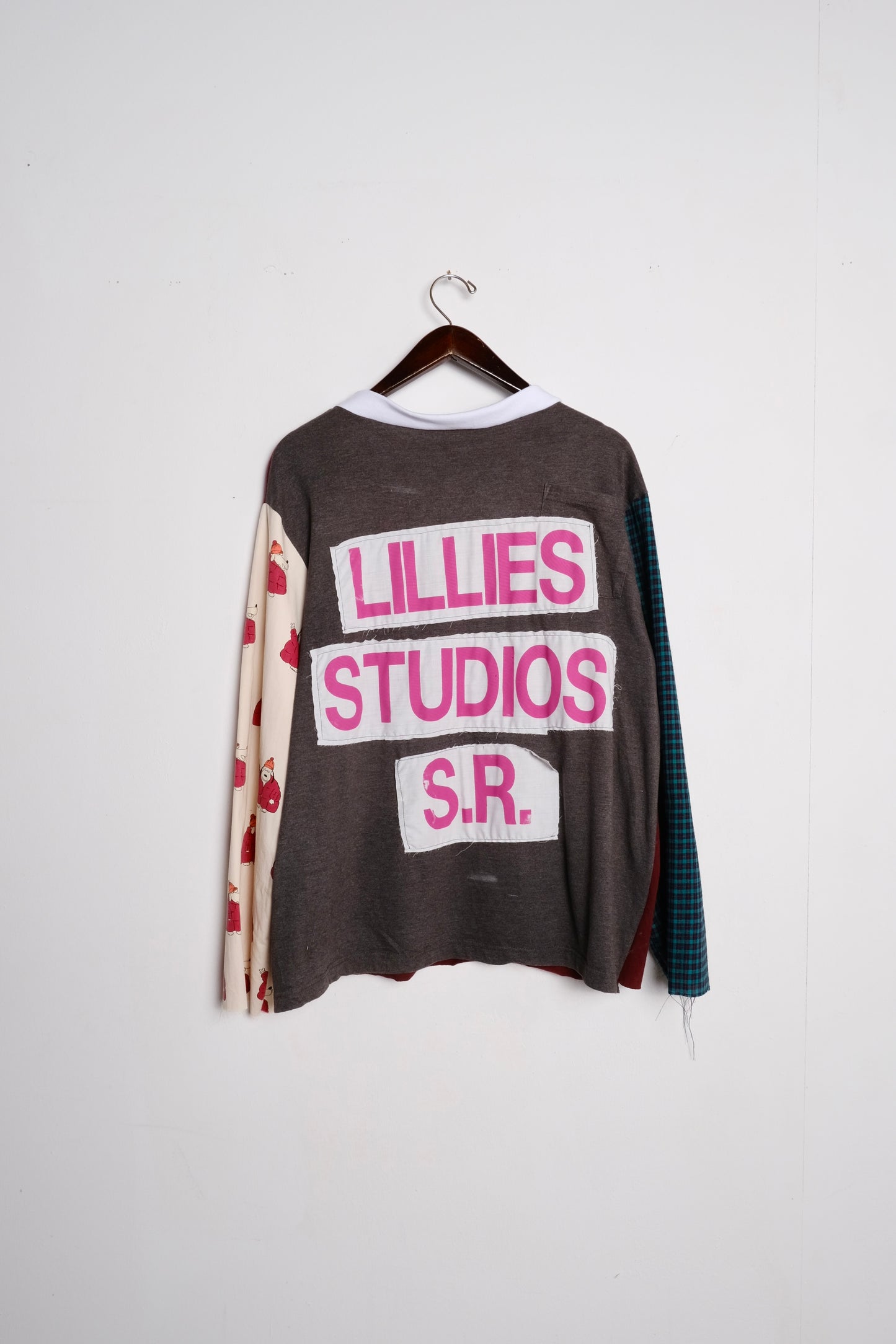 Long Sleeve Up-cycled Vintage Tee – back on hanger, grey body with pink Lillies Studios S.R. graphic print and mixed patchwork sleeves, upcycled – Lillies Studios
