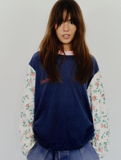 Long Sleeve Up-cycled Vintage Tee – front close-up worn, navy body with Lillies Studios chest patch and cream floral sleeves – Lillies Studios