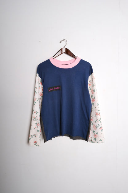 Long Sleeve Up-cycled Vintage Tee – front on hanger, navy body with pink ringer collar and cream floral patchwork sleeves, Lillies Studios chest patch, upcycled – Lillies Studios