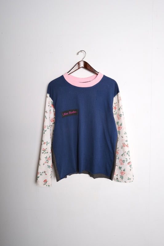 Long Sleeve Up-cycled Vintage Tee – front on hanger, navy body with pink ringer collar and cream floral patchwork sleeves, Lillies Studios chest patch, upcycled – Lillies Studios
