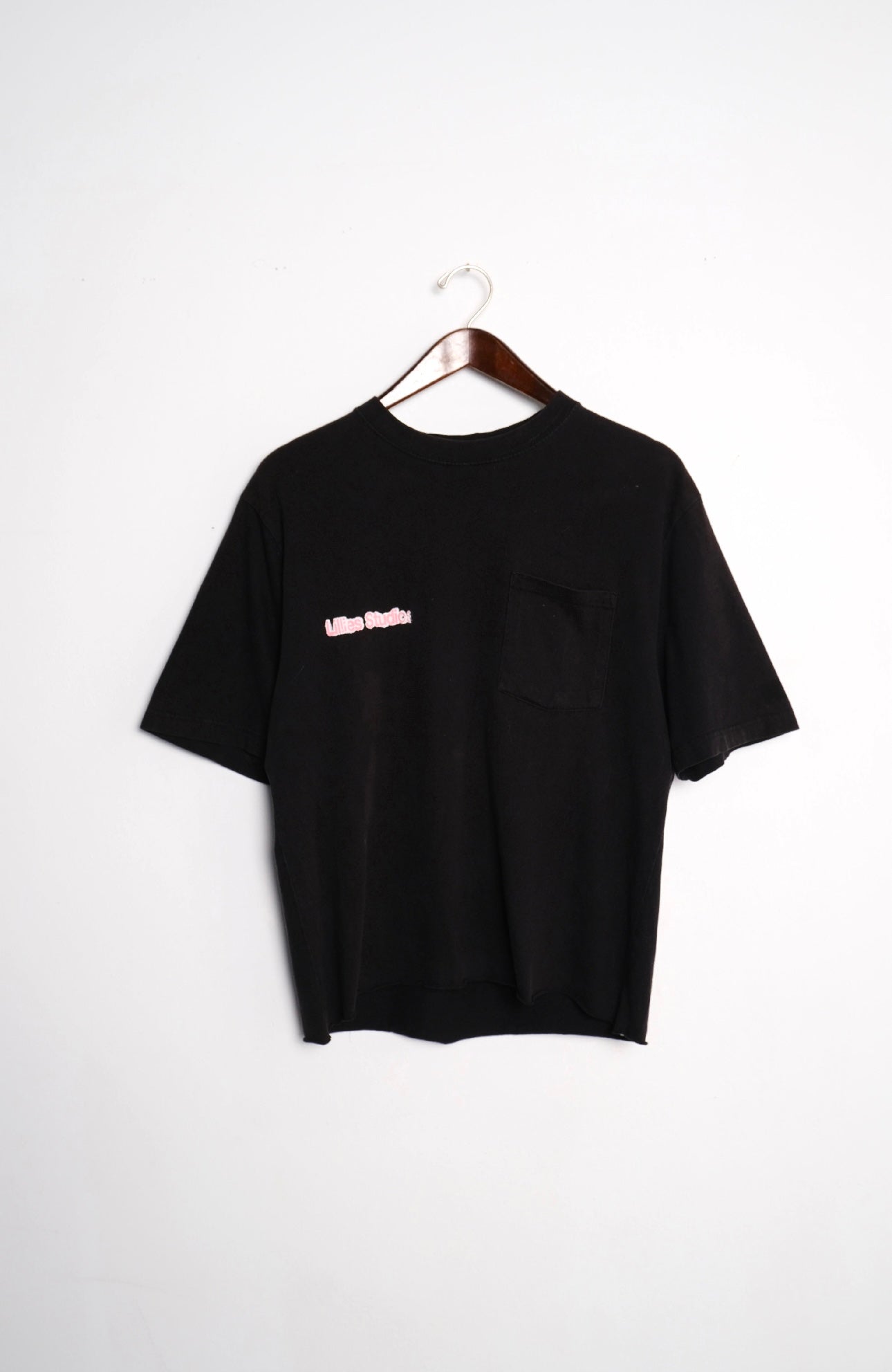 Recycled Black Graphic Print T-shirt – back on hanger with Lillies Studios chest logo, upcycled – Lillies Studios