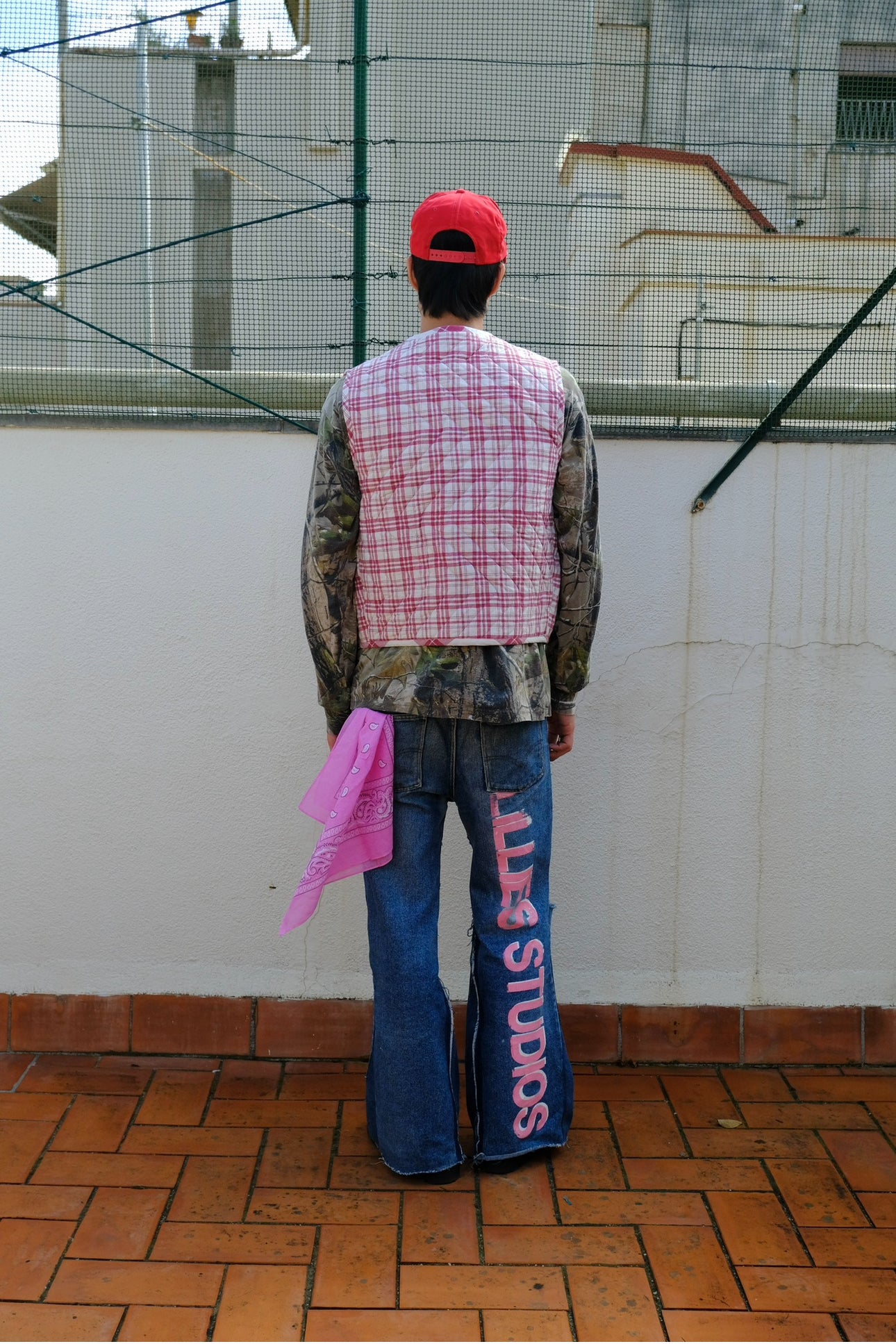 (worn back): Up-cycled Grandmother's Vest – back view worn, pink plaid quilted vest with Lillies Studios painted denim – Lillies Studios