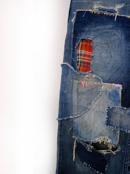 (left leg detail): Wide Leg Japanese Patchwork Denim – left leg close-up, red tartan and bleached denim patchwork with raw edge repairs, upcycled – Lillies Studios