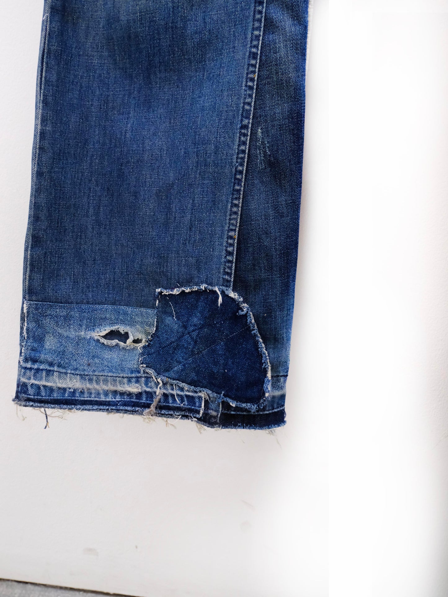 (hem detail): Wide Leg Japanese Patchwork Denim – raw hem detail, wide-leg upcycled denim with frayed patchwork hem repair – Lillies Studios