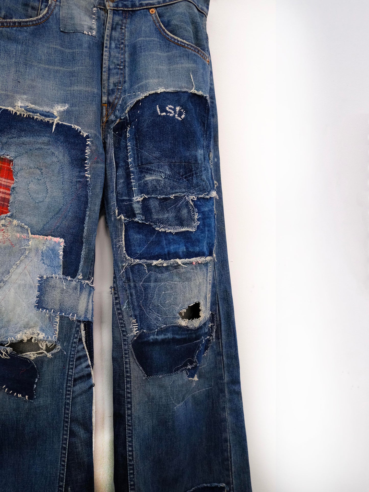 (front close-up knee): Wide Leg Japanese Patchwork Denim – knee detail, wide-leg jeans with frayed mixed fabric patchwork and LSD embroidery, upcycled – Lillies Studios