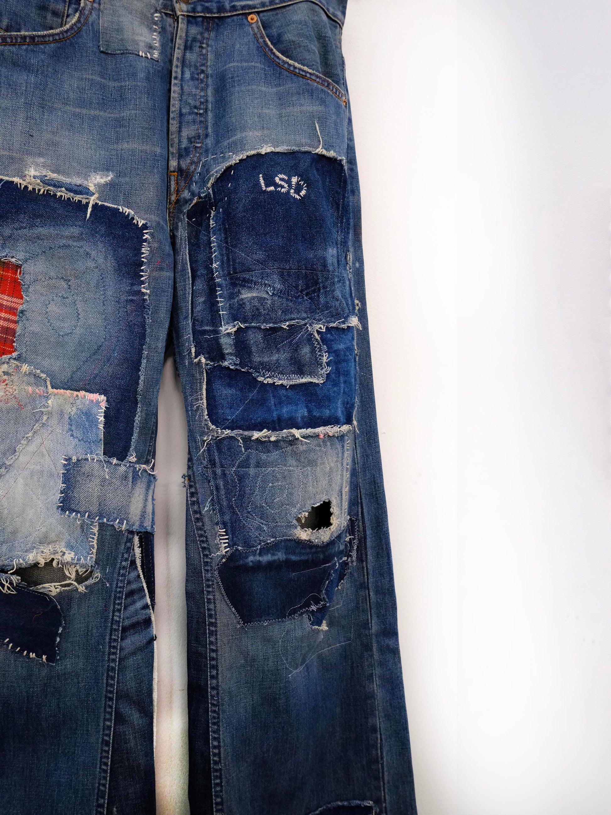 (front close-up knee): Wide Leg Japanese Patchwork Denim – knee detail, wide-leg jeans with frayed mixed fabric patchwork and LSD embroidery, upcycled – Lillies Studios