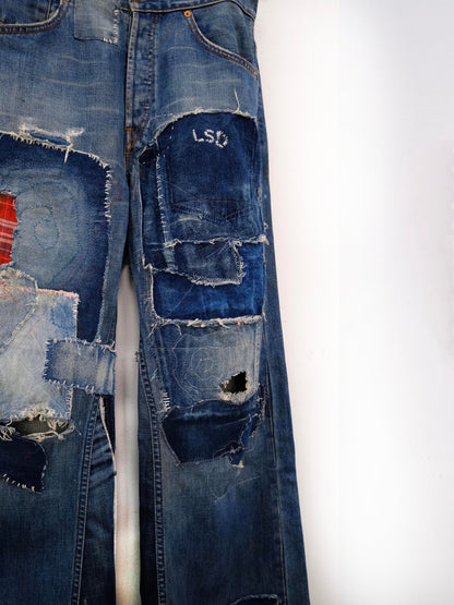 (front close-up knee): Wide Leg Japanese Patchwork Denim – knee detail, wide-leg jeans with frayed mixed fabric patchwork and LSD embroidery, upcycled – Lillies Studios